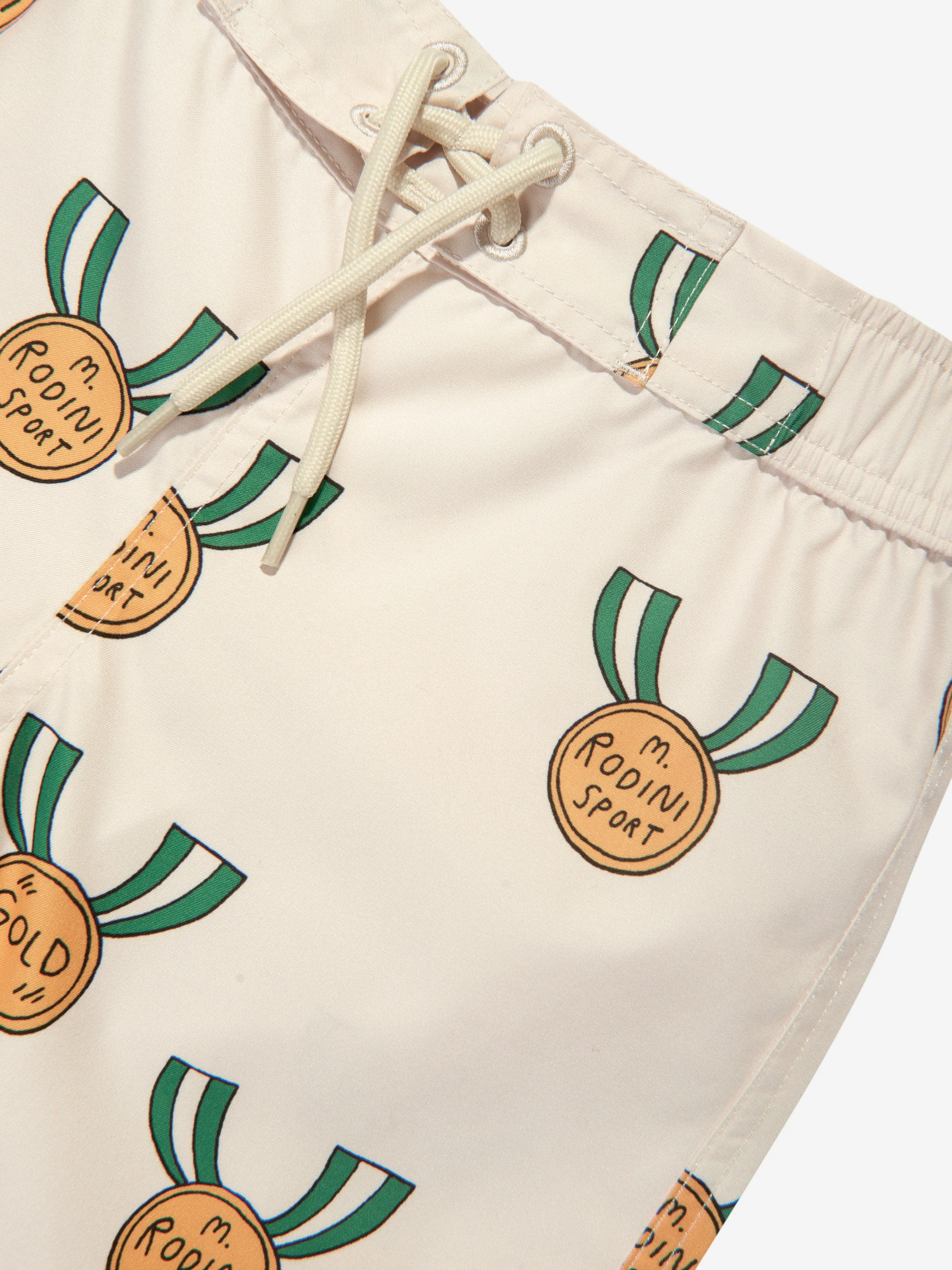 Mini Rodini Boys Medals Print Swim Shorts in Ivory